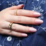 Natural-length nails with glossy gel colour overlay showing smooth strength